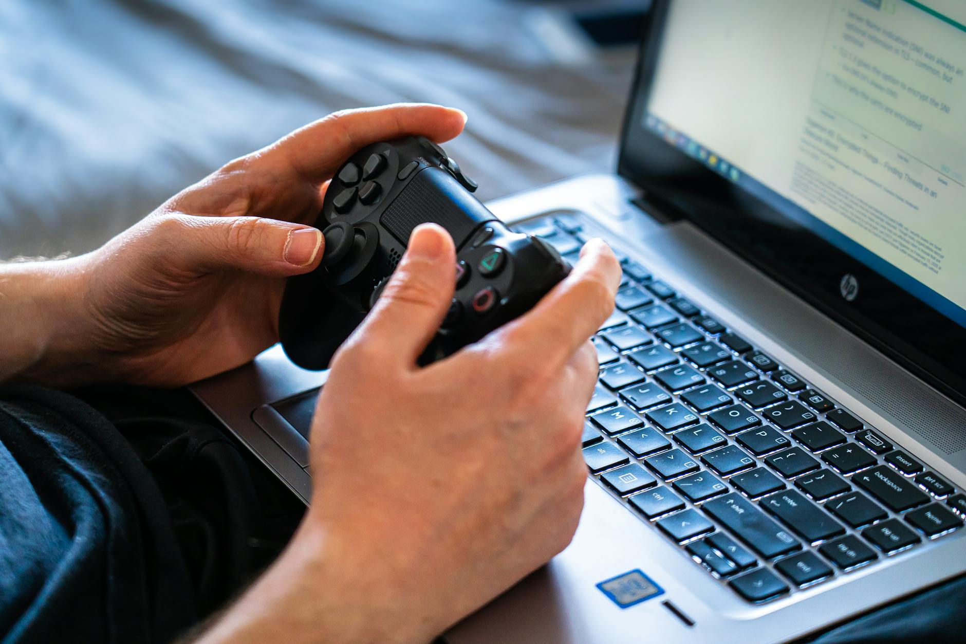High-end gaming laptop open on a desk displaying a graphics-intensive game