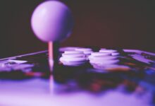 A game controller resting on a surface, representing competitive fighting game play