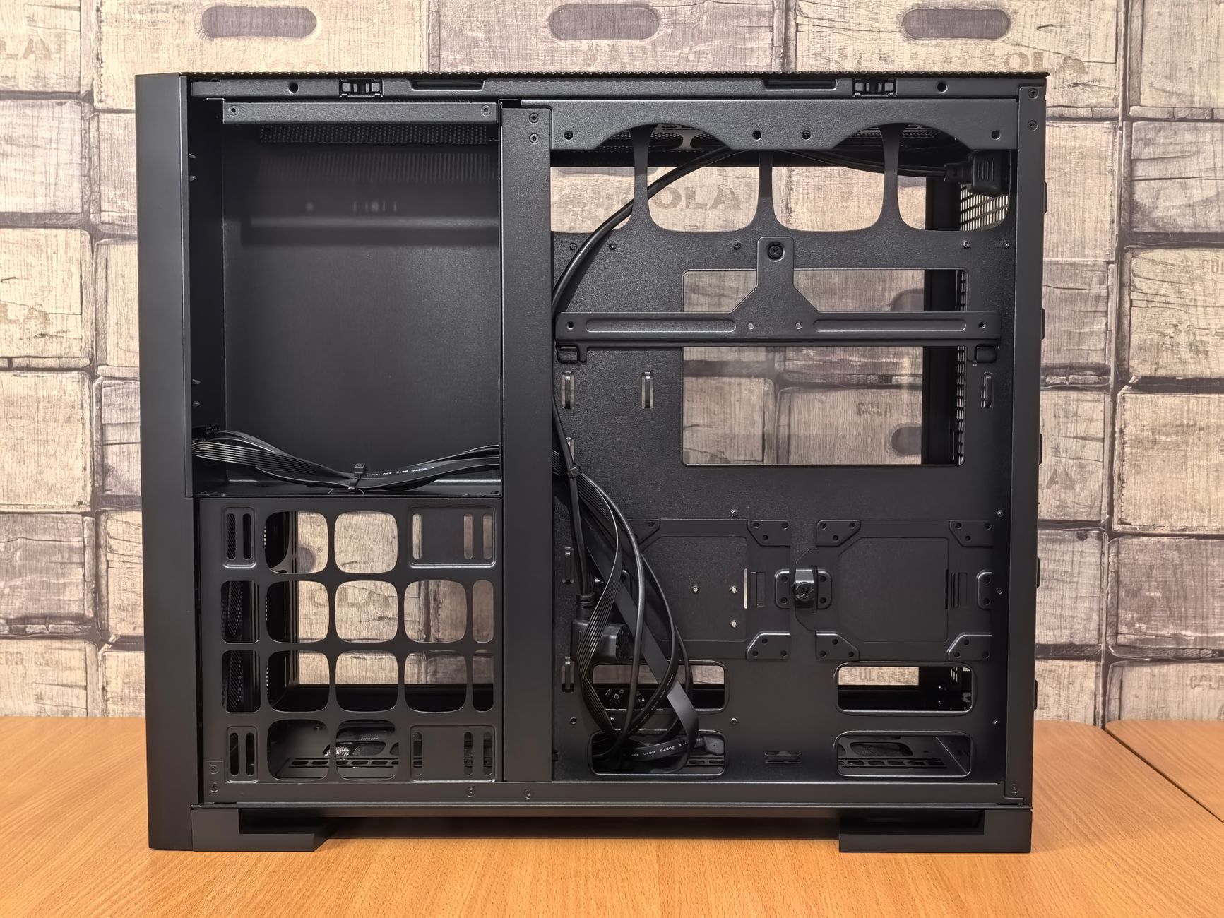 Interior of a gaming PC case showing airflow components and GPU installation