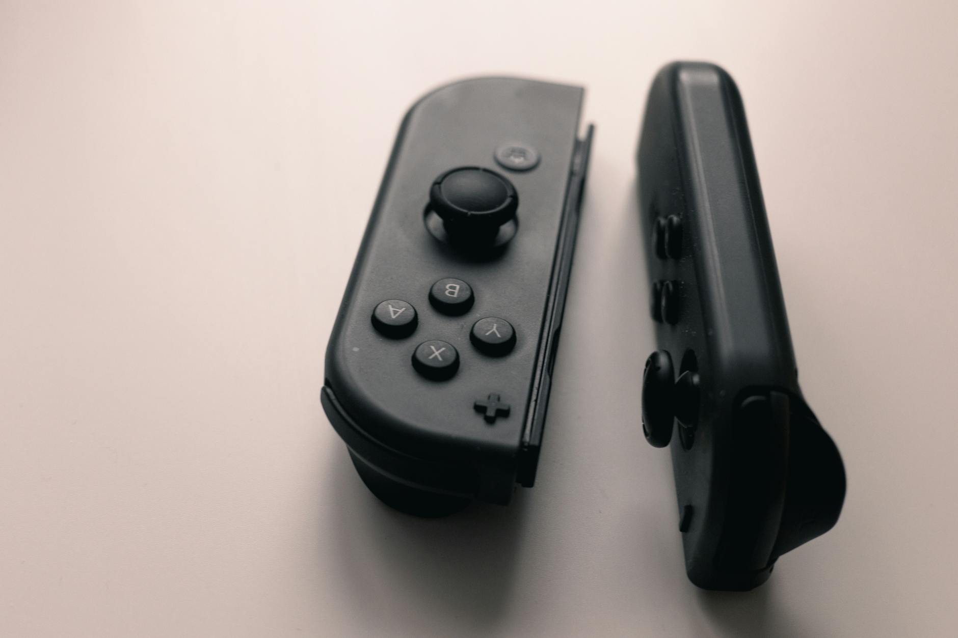 Close-up of handheld gaming device buttons and thumbsticks