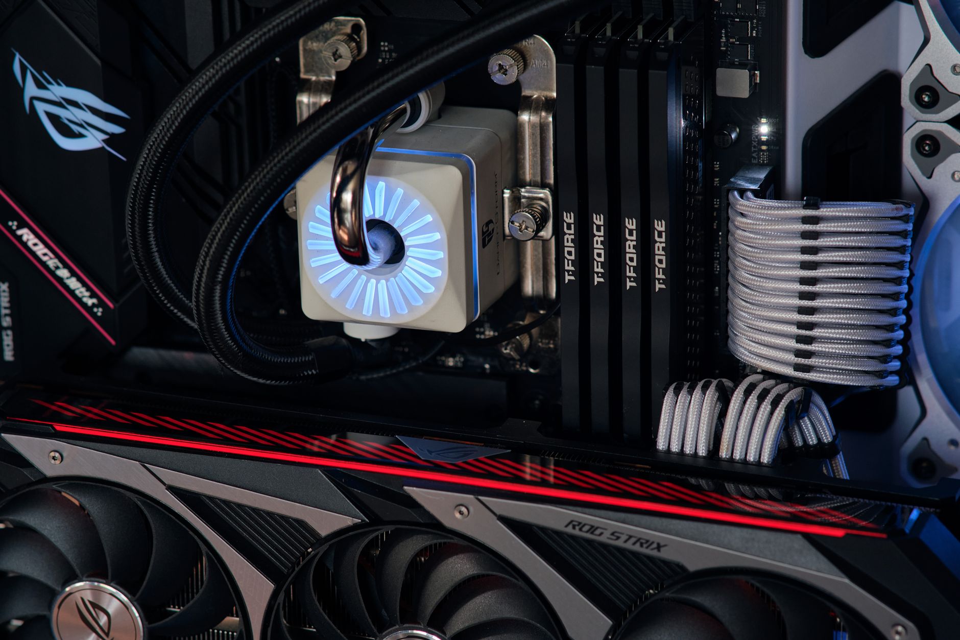 Close-up of 120mm case fans installed in a mesh PC case front panel