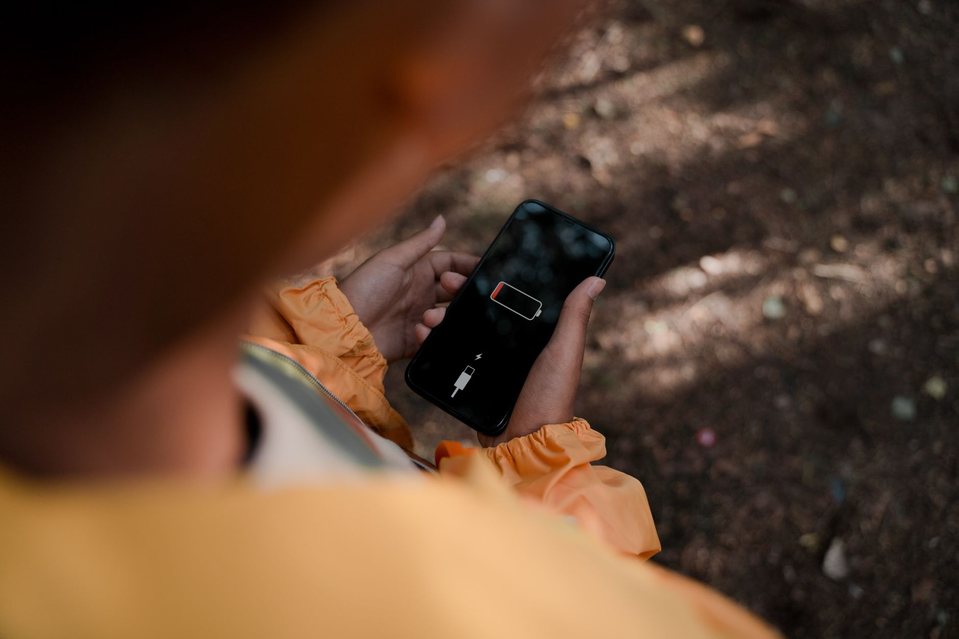Close-up of a device charging indicator showing battery percentage on screen