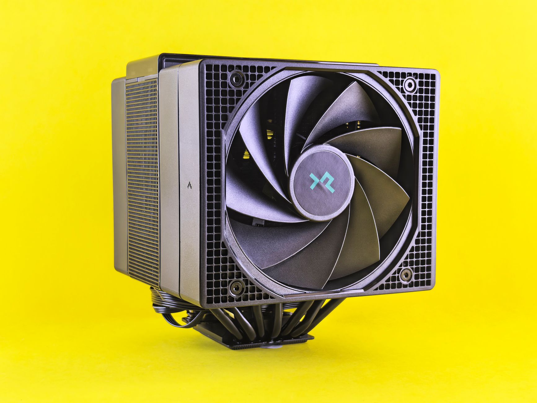 Close-up of a CPU cooler mounted on a computer motherboard