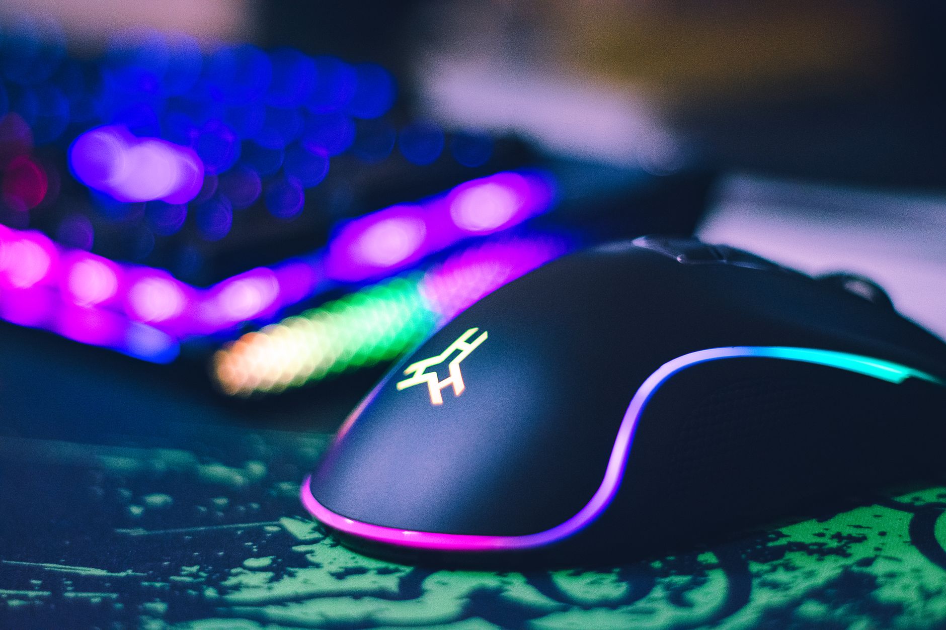 Gaming peripherals arranged on a desk including mouse and keyboard