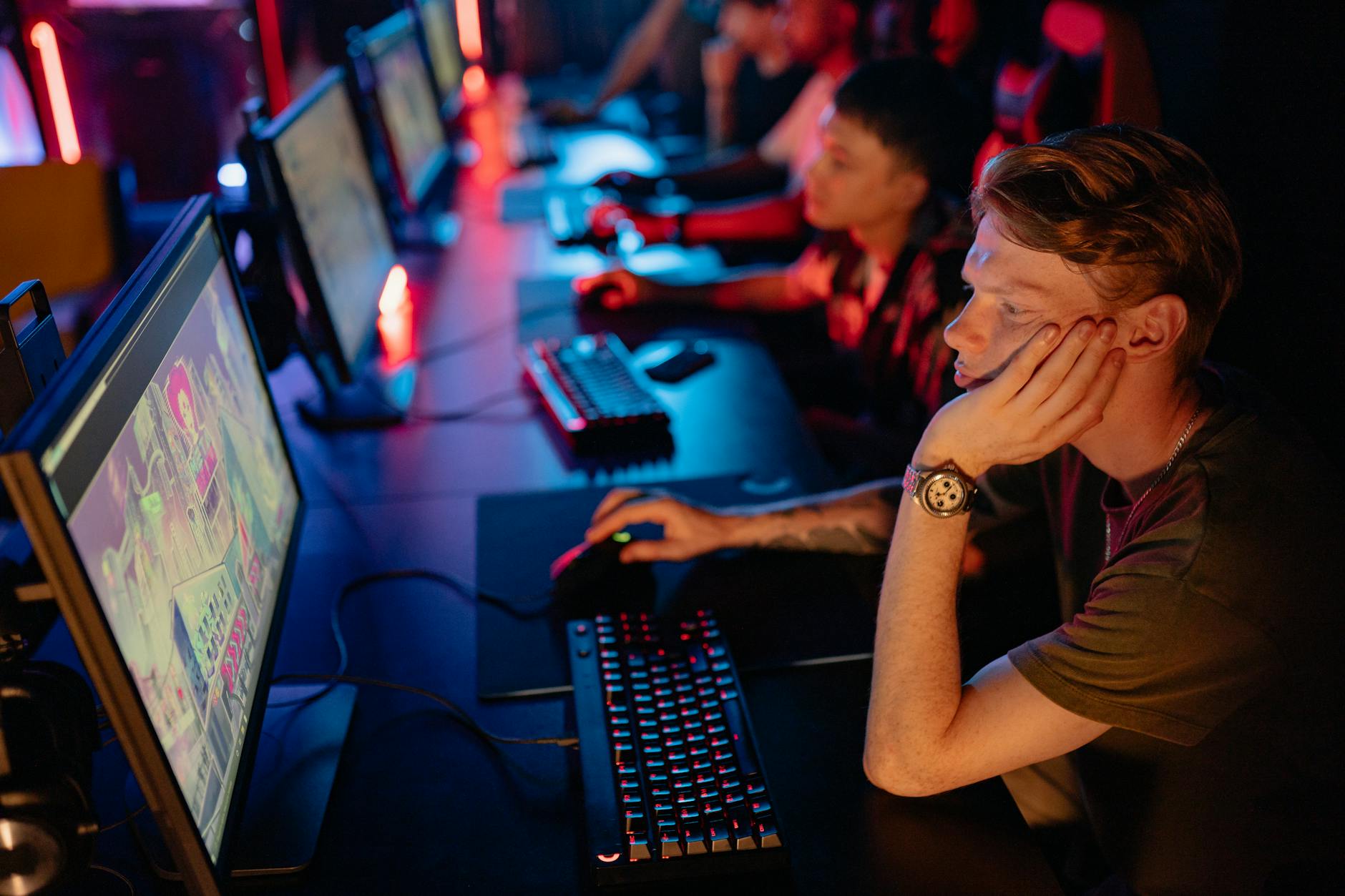 Competitive esports player at a gaming station during a tournament match