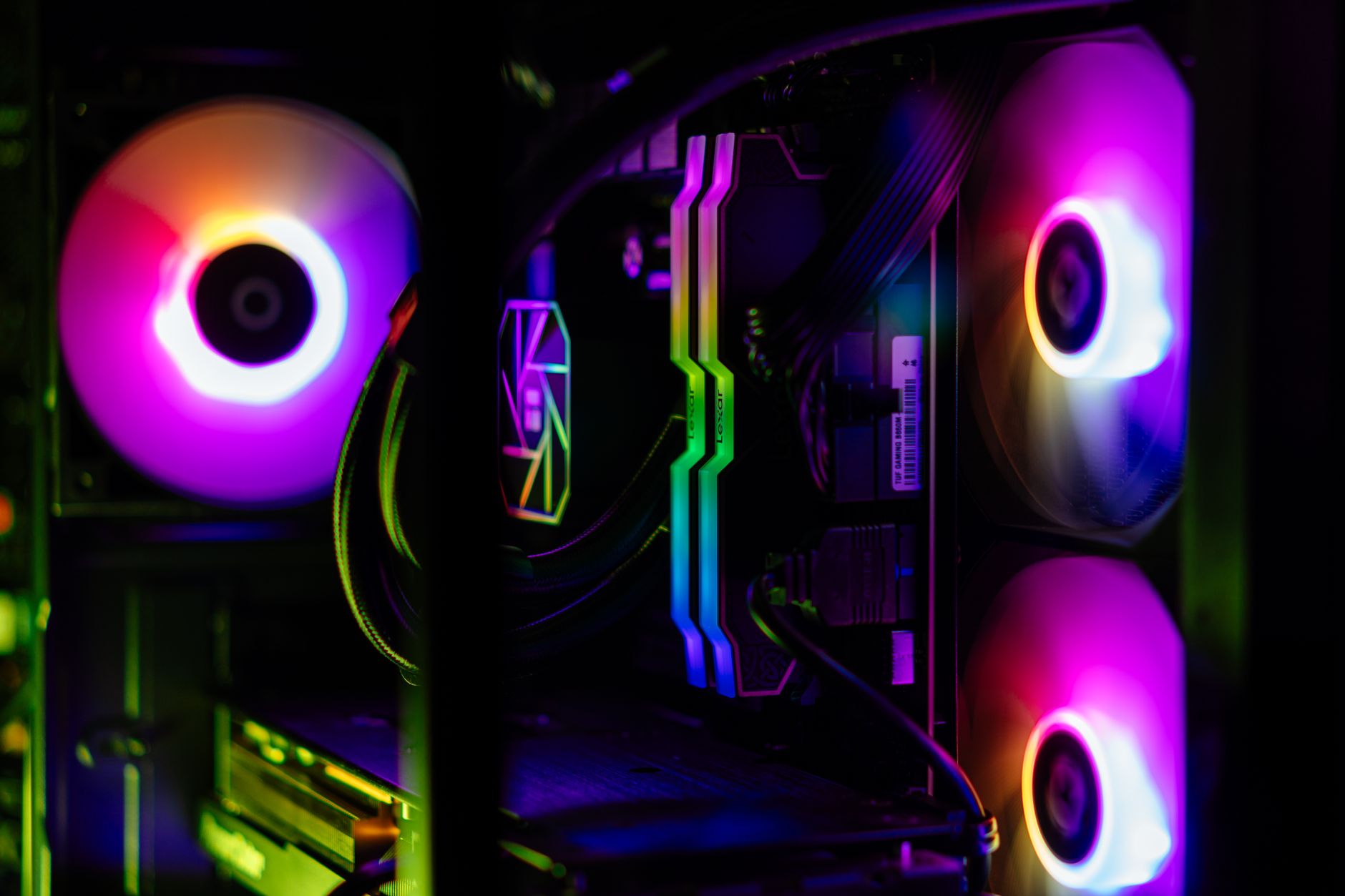 Close-up of RGB RAM modules glowing inside a windowed PC case