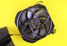 Close-up of a high-performance CPU air cooler with ARGB lighting installed on a desktop PC motherboard