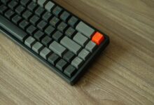 Close-up of a backlit mechanical gaming keyboard on a desk