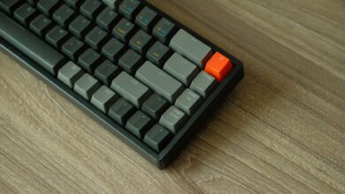 Close-up of a backlit mechanical gaming keyboard on a desk