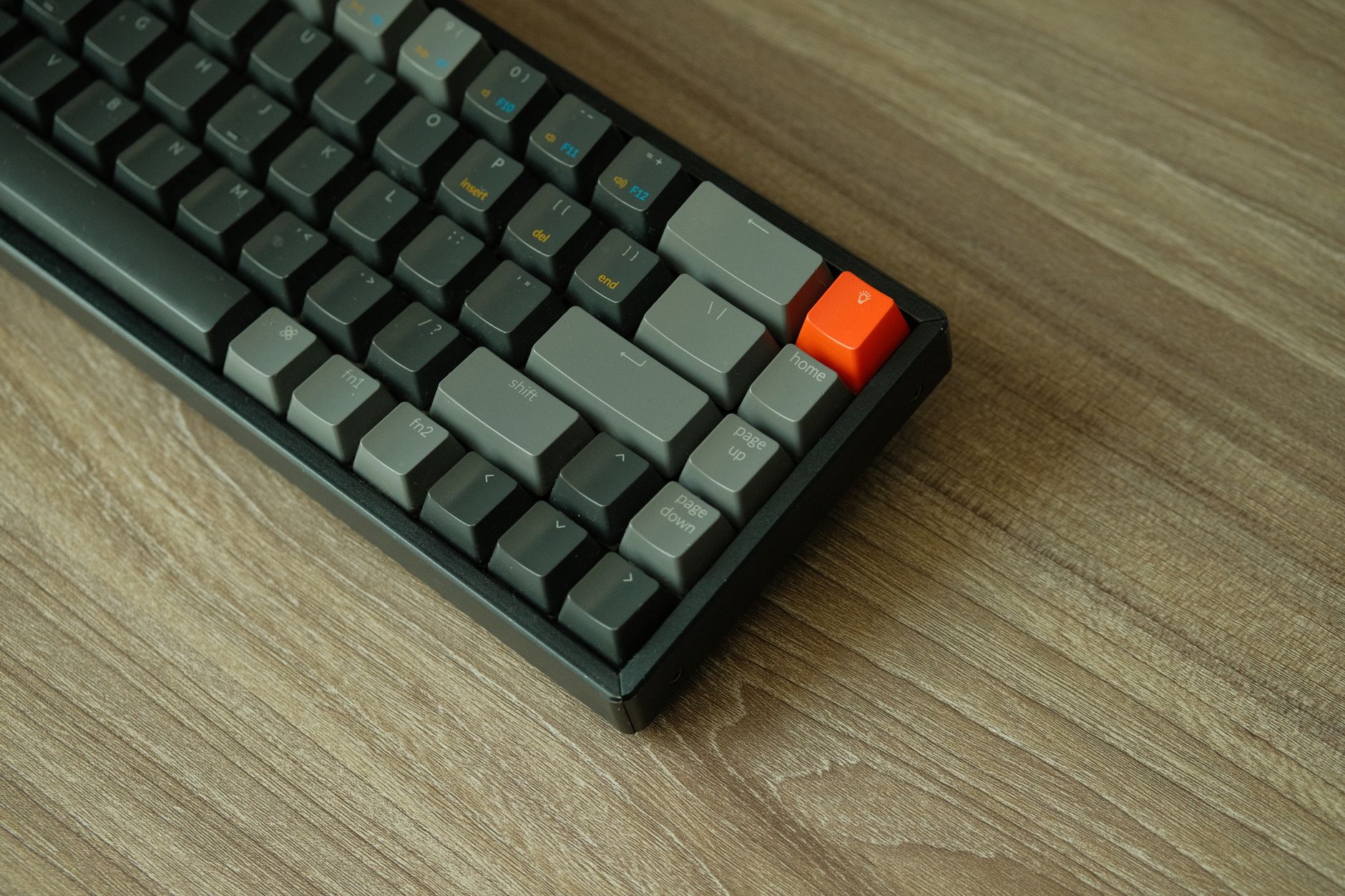 Close-up of a backlit mechanical gaming keyboard on a desk