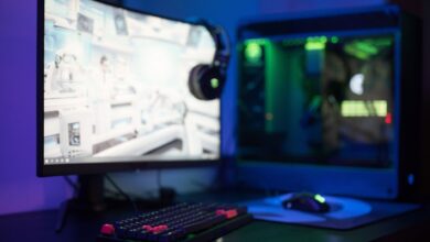 High-end gaming PC setup with RGB components and multiple monitors at 1440p resolution