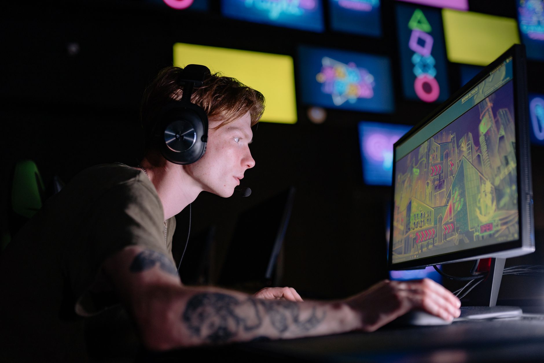 Competitive esports player focused on a high-refresh-rate monitor during gameplay