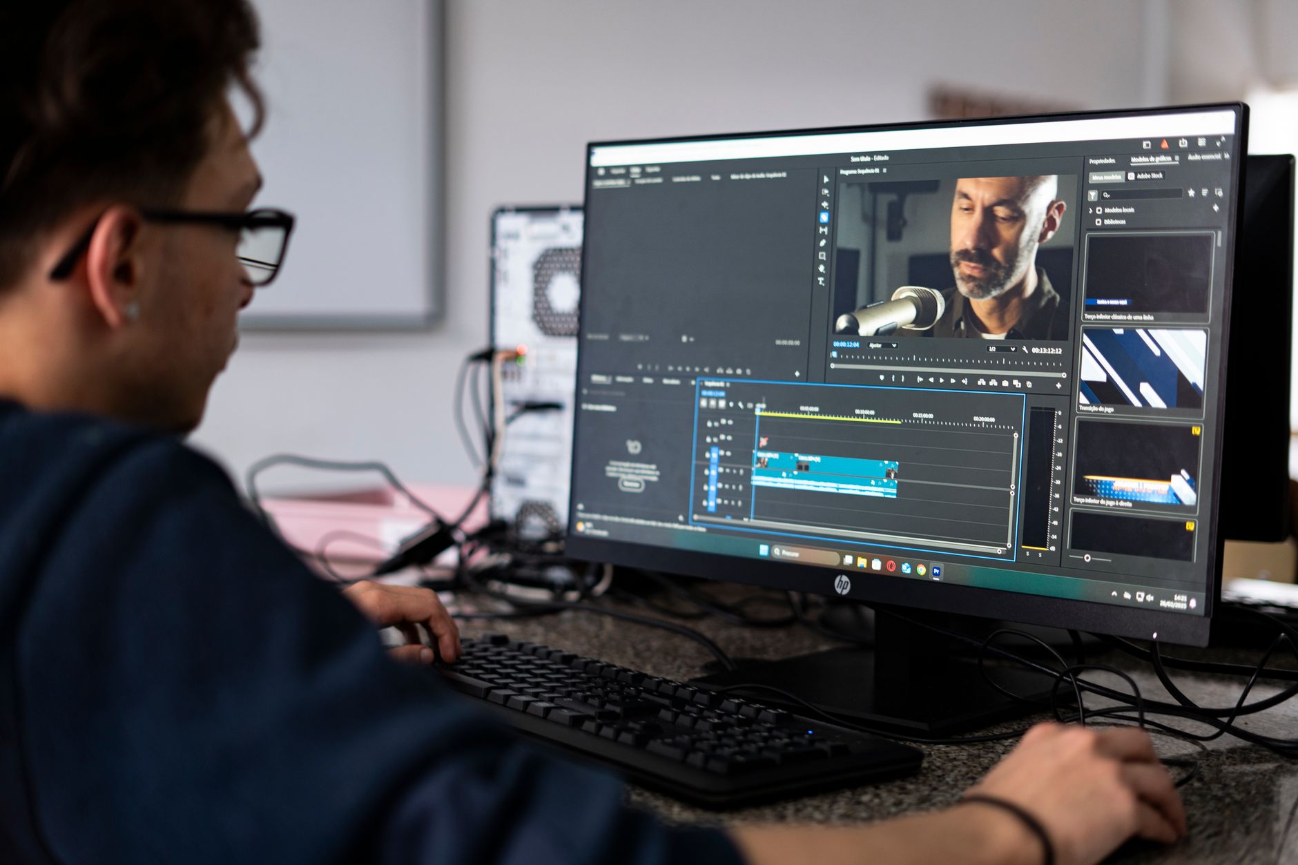 Professional video editor working on a color grading timeline on a high-performance workstation
