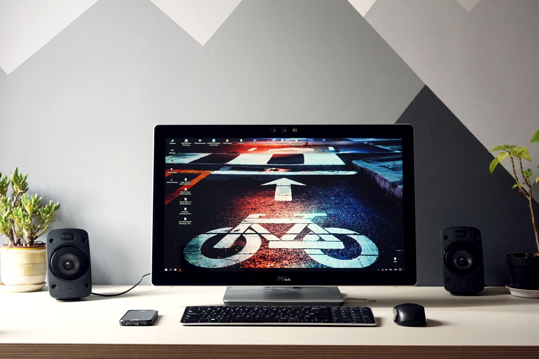 A high-performance desktop workstation setup with multiple monitors displaying creative software