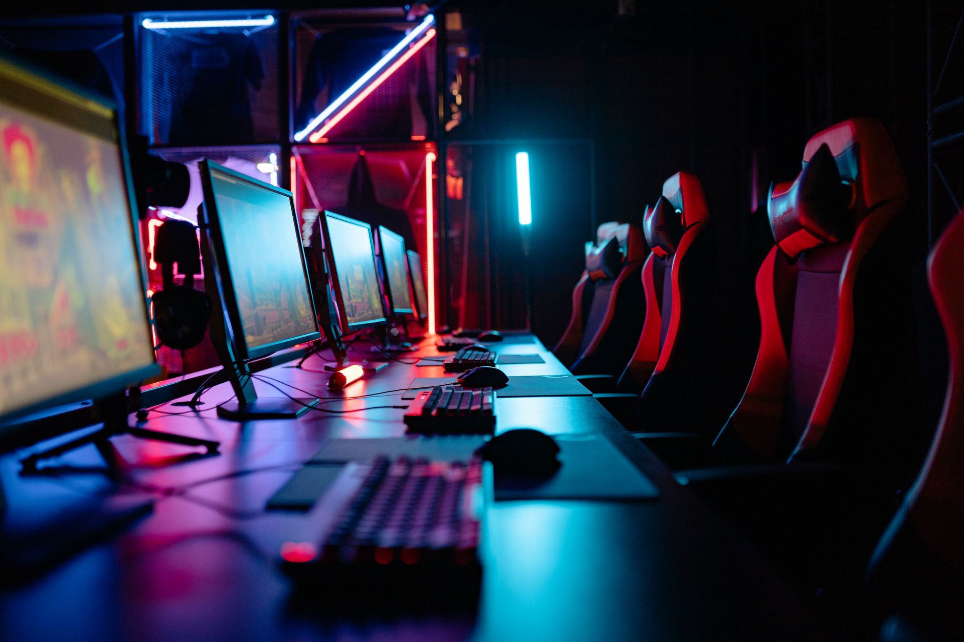Gaming PC setup at a desk with a monitor displaying a game at high resolution