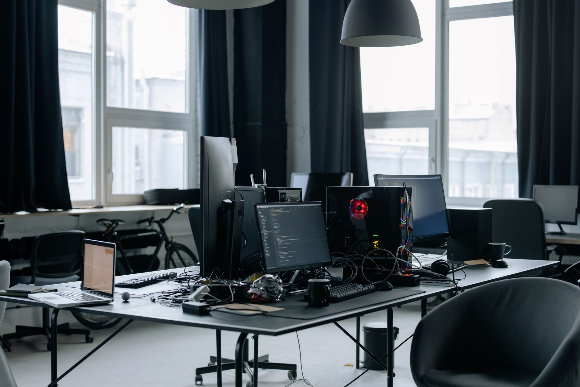 Professional editing workstation setup with multiple monitors for post-production work