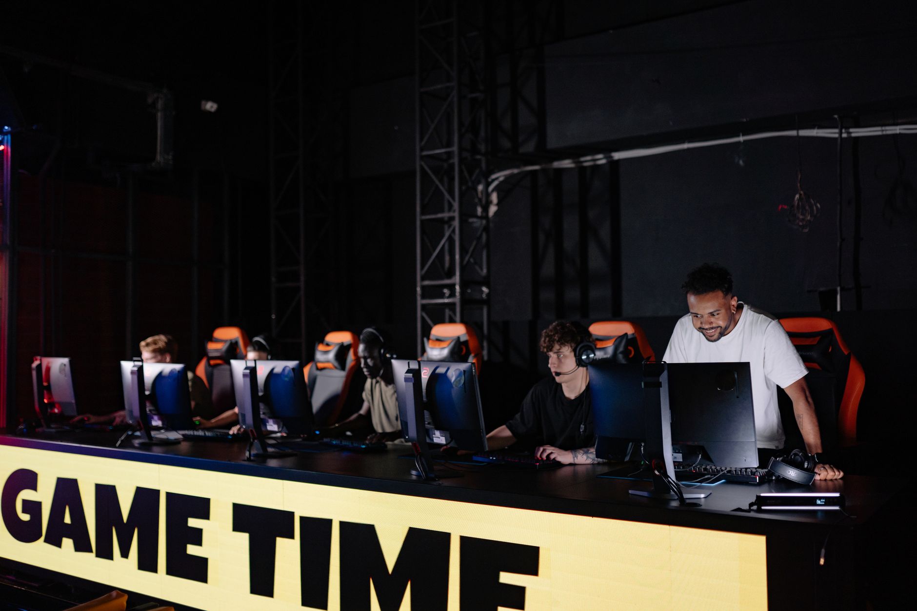 Professional esports players at a competitive gaming station during a tournament