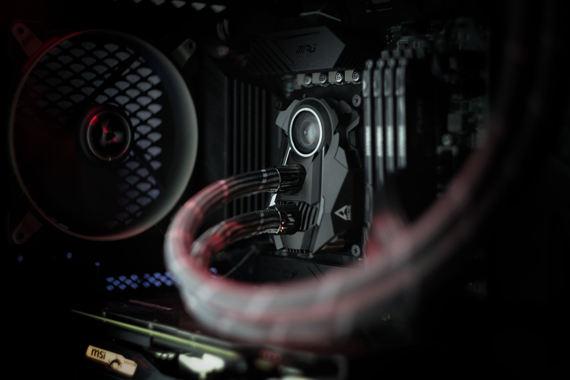 Interior of a gaming PC showing GPU cooling and airflow components