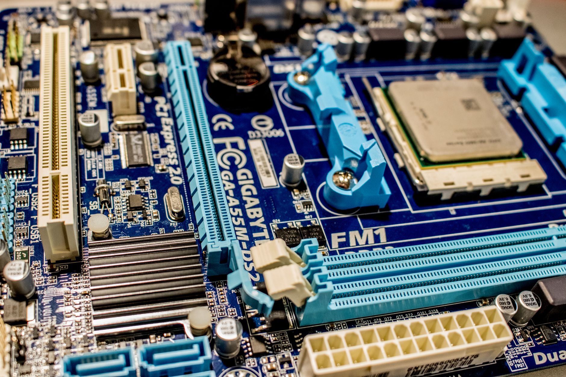 Desktop PC components including motherboard and processor in an open test bench configuration
