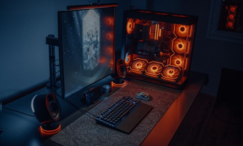 Gaming PC setup with glowing components on a desk