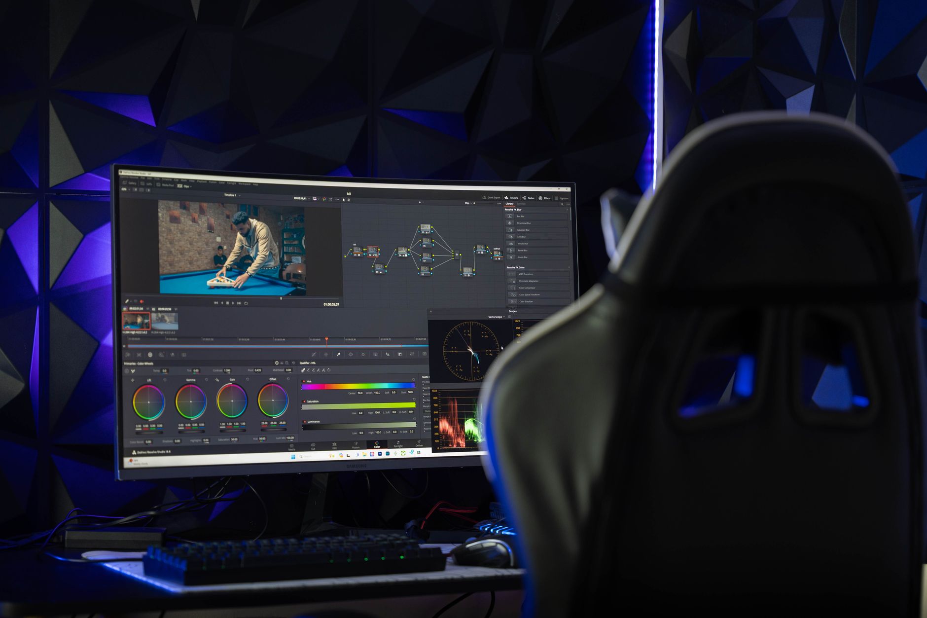 Professional video editing workstation with multiple monitors showing timeline software