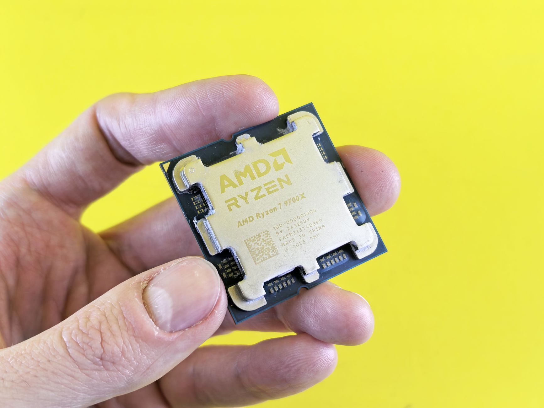 Close-up of a modern computer processor chip on a motherboard, illustrating CPU hardware comparison