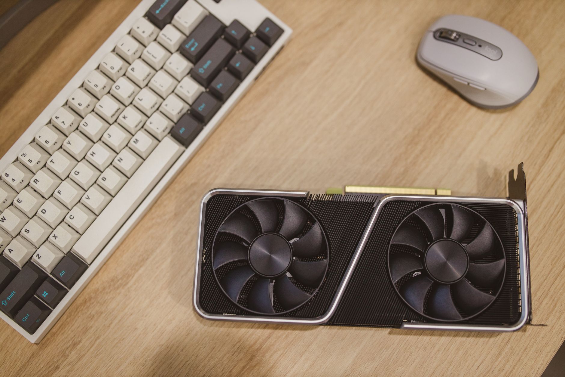 Close-up of a modern graphics card showing cooling fans and circuit board detail