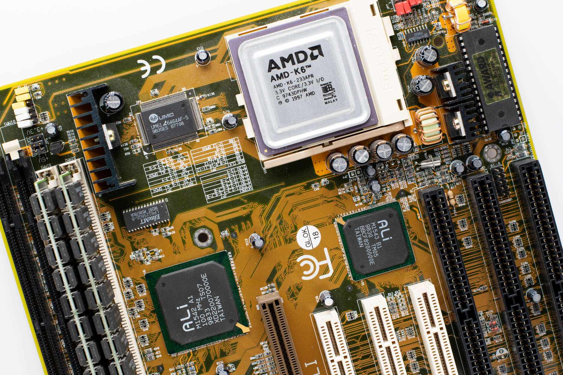 Gaming PC components laid out including GPU and motherboard for comparison testing