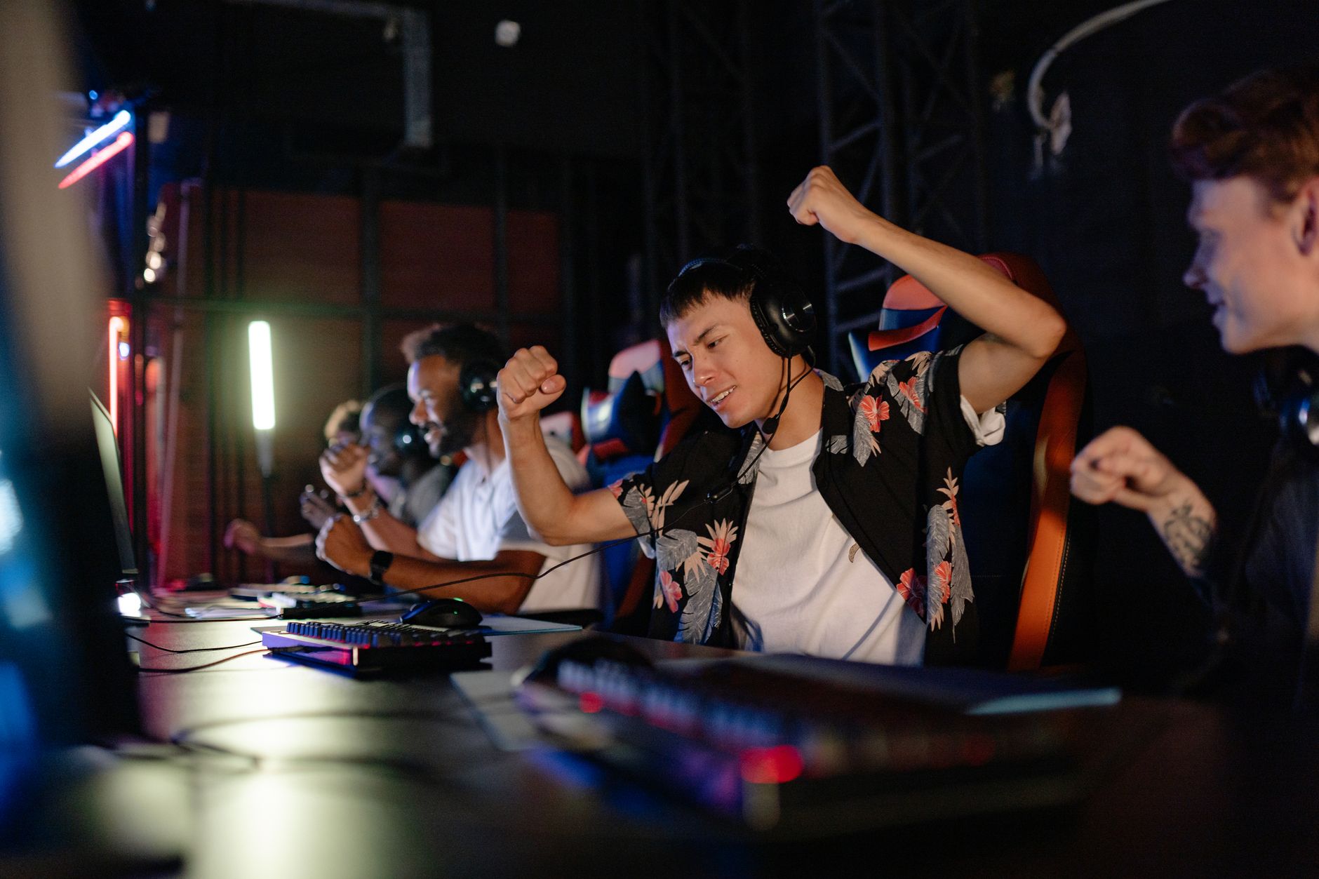 Players competing at a professional gaming tournament on stage