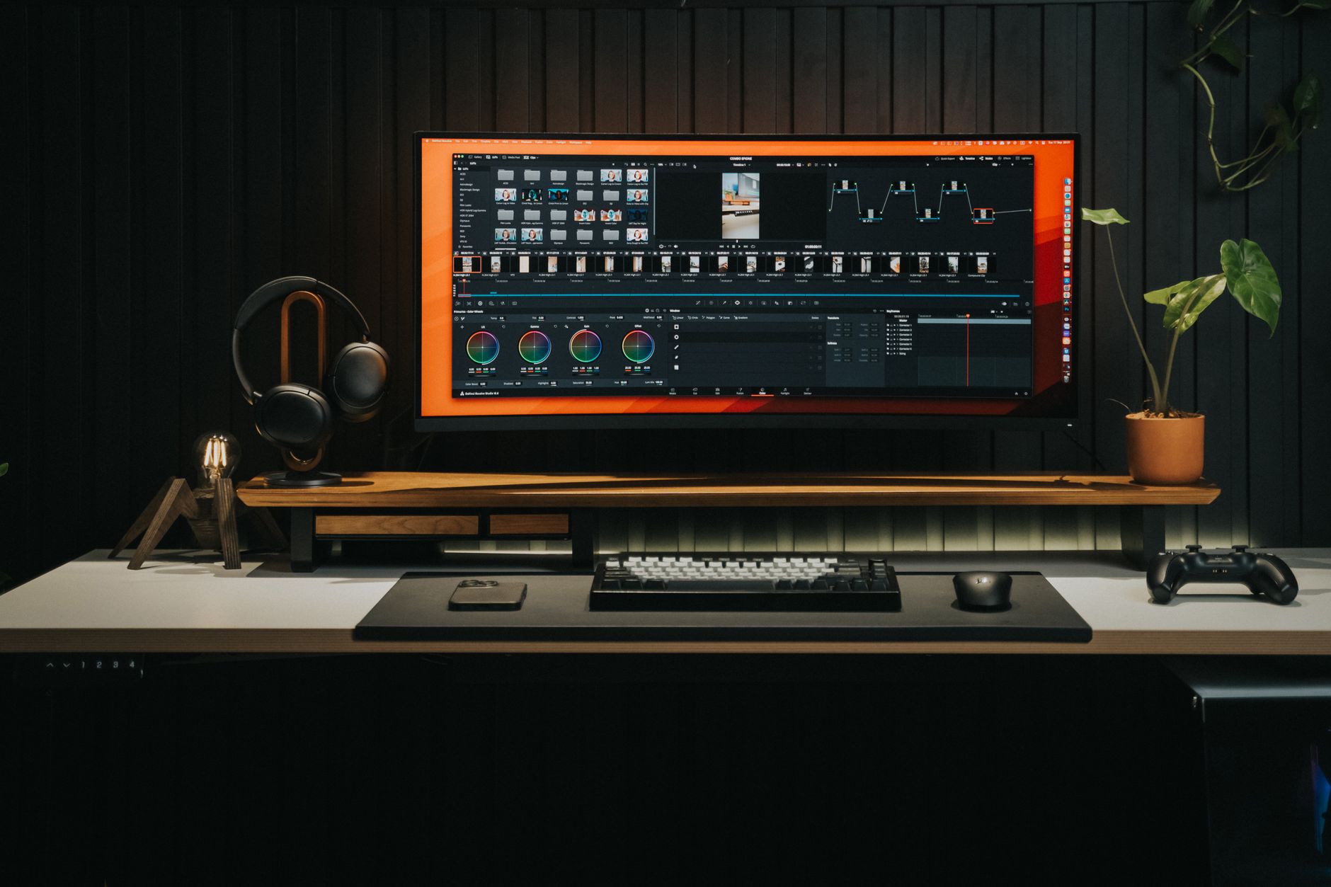 Professional video editing workstation with multiple monitors displaying timeline software