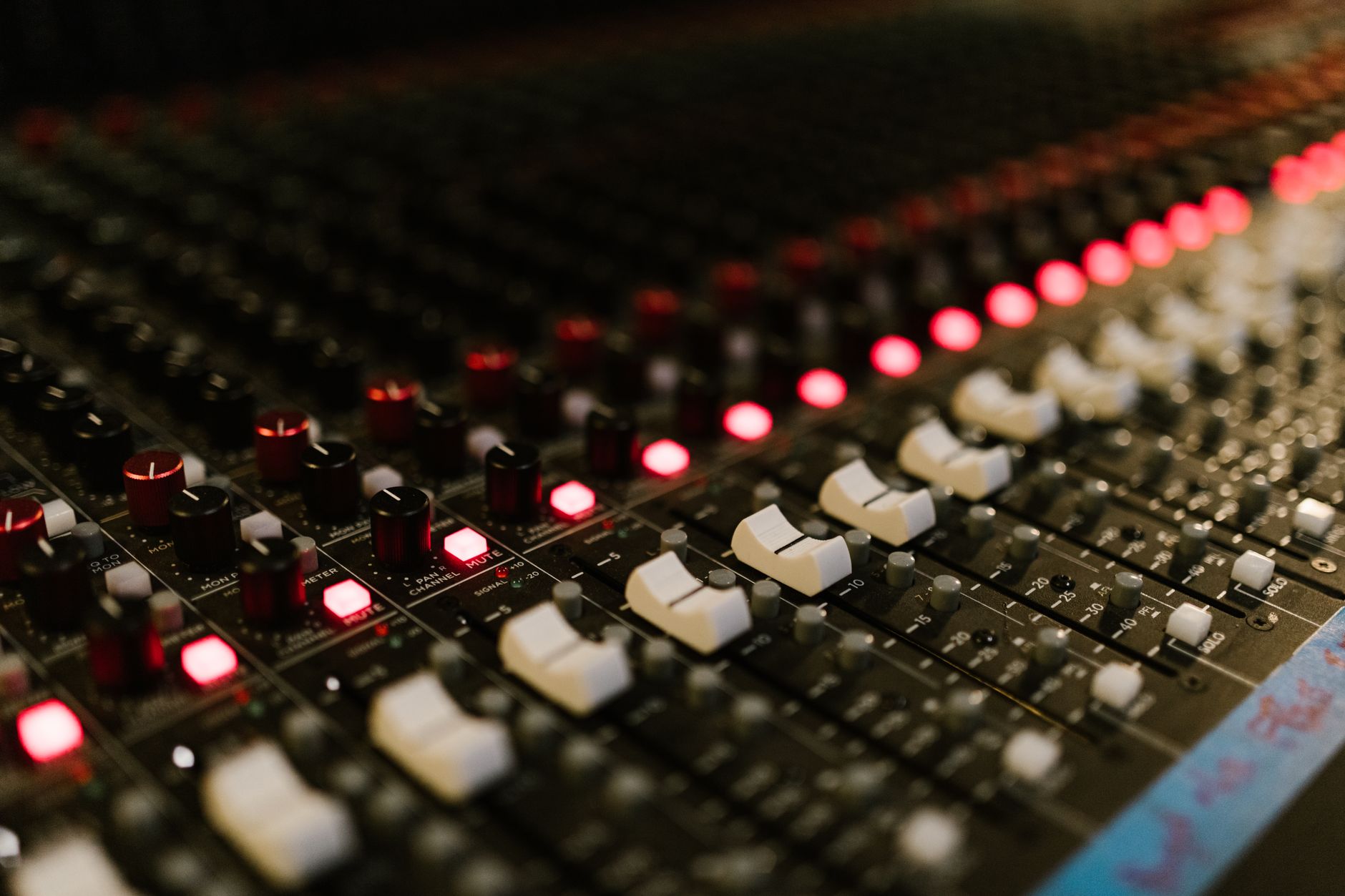 Music producer working at a DAW workstation in a recording studio