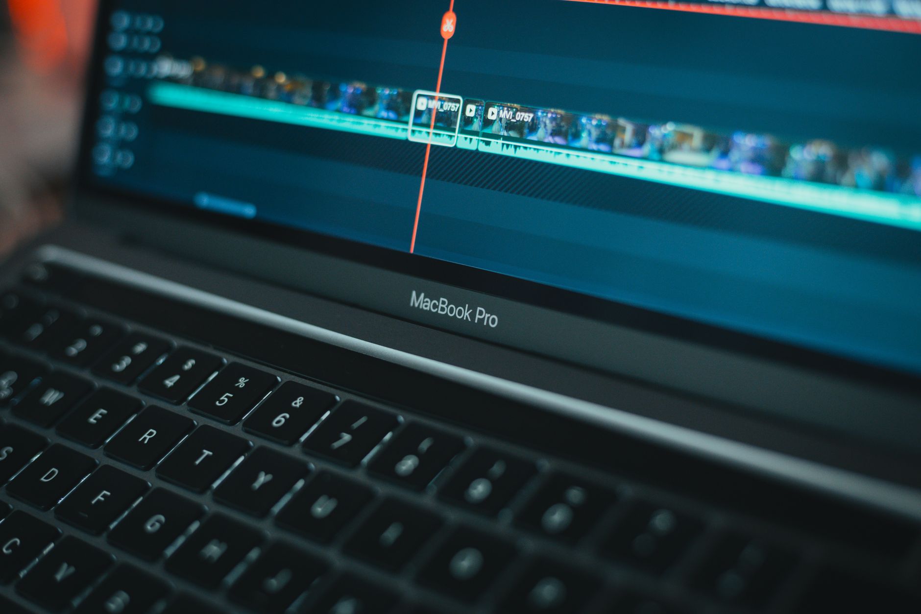 Professional video editing setup with multiple monitors and timeline software